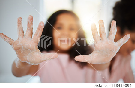 Girl kid, washing hands and palm in closeup with foam, cleaning and learning hygiene in family home. Young child, soap and mother for bacteria, germs and stop virus for care, bond and love in house 118419094