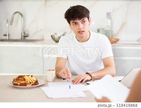 Guy manager tells woman client about specifics of design of microloan, about benefits and advantages 118419868