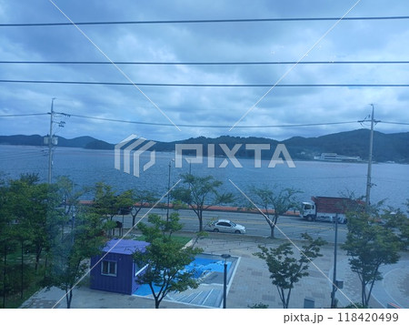 Tongyeong-si, Gyeongsangnam-do, South Korea - September 15, 2024: Enjoyable lunch with the family at an Italian restaurant with a great sea view. Tongyeong-si, Gyeongsangnam-do, South Korea - September 15, 2024: Enjoyable lunch with the family at an Italian restaurant with a great sea view. 118420499