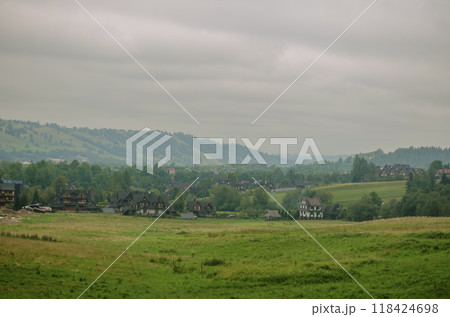 view of mountains and valleys in cloudy weather in early autumn . High quality photo view of mountains and valleys in cloudy weather in early autumn . High quality photo 118424698