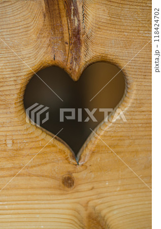 Wooden shutter with heart cutout. High quality photo Wooden shutter with heart cutout. High quality photo 118424702