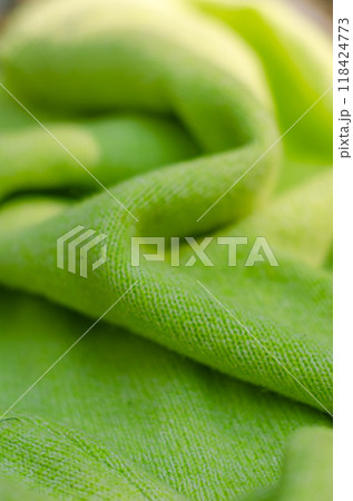Green cloth waves background texture. Green fabric cloth textile material. High quality photo 118424773
