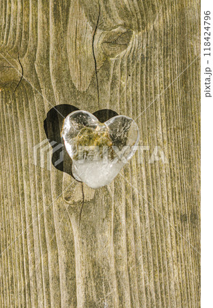 heart shaped ice cube on the wooden floor . High quality photo heart shaped ice cube on the wooden floor . High quality photo 118424796