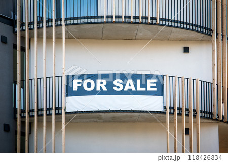 For sale sign outside a apartment building 118426834