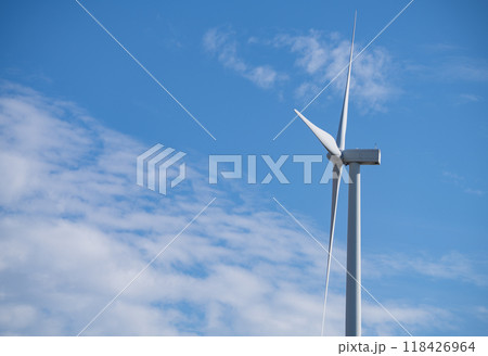 Wind turbines against blue sky, Wind energy. Wind power. Sustainable, renewable energy. Wind turbine generate electricity. Sustainable resources. Green technology for energy sustainability. Wind turbines against blue sky, Wind energy. Wind power. Sustainable, renewable energy. Wind turbine generate electricity. Sustainable resources. Green technology for energy sustainability. 118426964