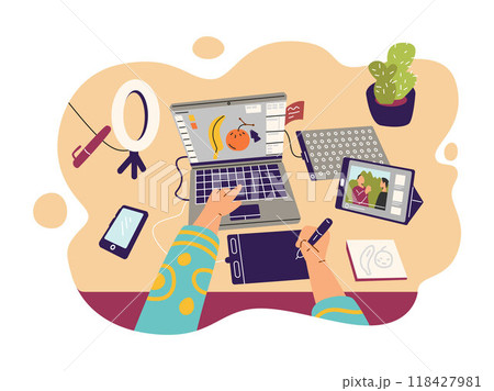 Designer works in a graphics program on a laptop. Top view. Designer works in a graphics program on a laptop. Top view. 118427981