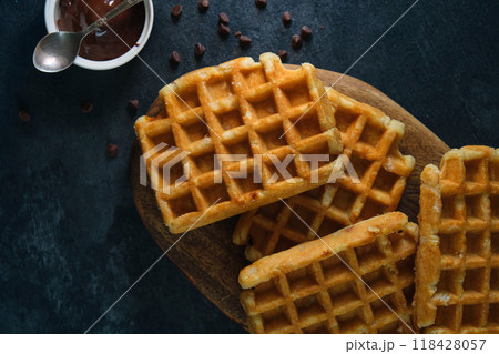 Belgian waffles on a dark background Belgian waffles on a dark background 118428057