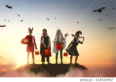 children in carnival costumes at Halloween 118428462