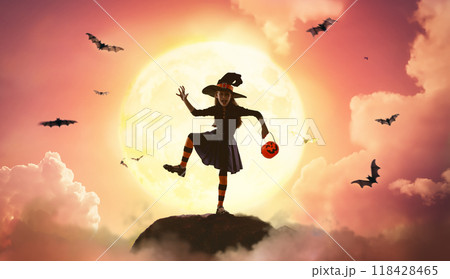 girl in witch costume at Halloween 118428465