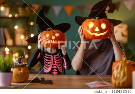 Happy family preparing for Halloween. Happy family preparing for Halloween. 118428516