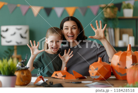 Happy family preparing for Halloween. Happy family preparing for Halloween. 118428518