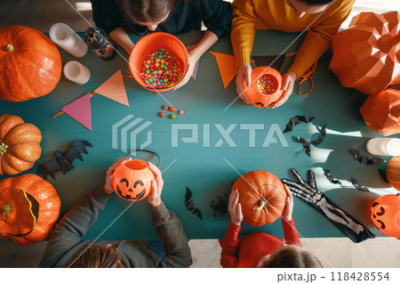 Happy family preparing for Halloween. Happy family preparing for Halloween. 118428554