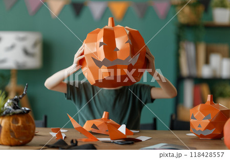 girl with polygonal paper pumpkin girl with polygonal paper pumpkin 118428557