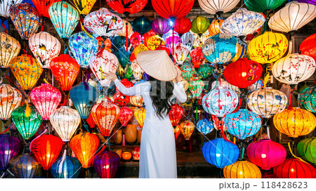 Asian woman wearing vietnam culture traditional and hoi an lanterns at Hoi An ancient town, Vietnam. 118428623