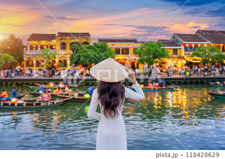 Asian woman wearing vietnam culture traditional at Hoi An ancient town,Hoi an city in Vietnam. 118428629