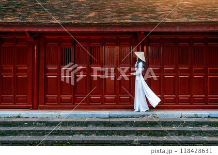 Asian woman wearing vietnam culture traditional walking in Hue, Vietnam. 118428631