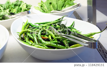 Large dish of green chili peppers Large dish of green chili peppers 118429131