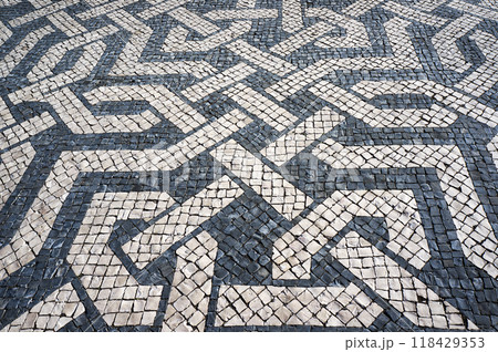 Traditional Mosaic Pavement Tiles Pattern in Lisbon, Portugal. 118429353