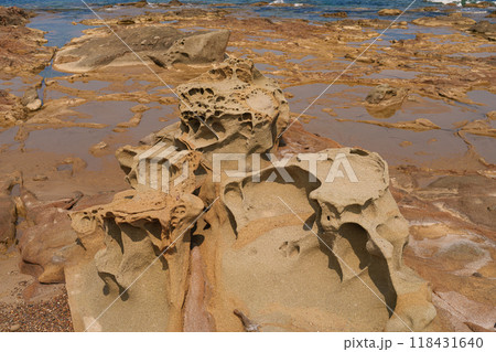 Eroded Sandstone Rock Formations by the Shoreline 118431640