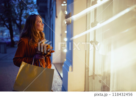 young 40 years old woman in brown trench coat 118432456