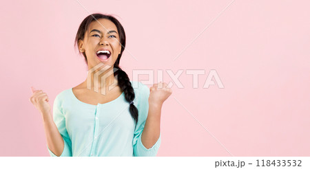 Overjoyed girl celebrating victory or triumph over pink background, crop Overjoyed girl celebrating victory or triumph over pink background, crop 118433532
