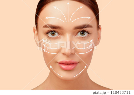 Lifted and Rejuvenated. Pretty Young Woman's Face With Lifting Arrows On Perfect Smooth Skin, Beauty Portrait On White Studio Background. Plastic Surgery And Antiaging Facial Massage Concept 118433711