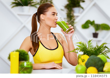 Healthy Lifestyle. Slim Girl Drinking Smoothie After Training, Sitting In Kitchen 118434373