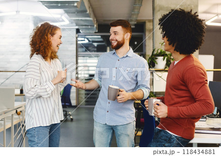 Love my colleagues. Diverse business team enjoying coffee break and communication at office 118434881