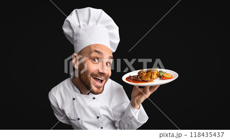 Funny Chef Cook Man Showing Chicken Dish On Plate Posing On Black Background. Panorama, Studio Shot Funny Chef Cook Man Showing Chicken Dish On Plate Posing On Black Background. Panorama, Studio Shot 118435437