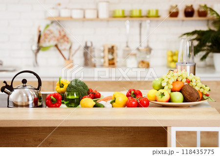 Fresh Vegetables And Fruits On Kitchen Table, Modern Kitchen Interior Fresh Vegetables And Fruits On Kitchen Table, Modern Kitchen Interior 118435775