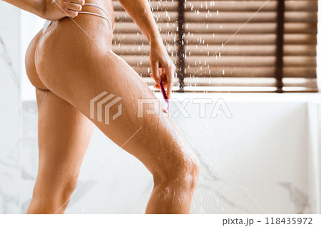 Slim Woman Shaving Leg, Taking Shower At Home, Crop 118435972