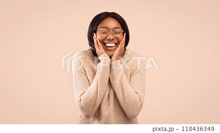 Joy. Happy Afro Girl Holding Hands On Cheeks And Smiling Standing Over Pink Studio Background. Panorama, Free Space Joy. Happy Afro Girl Holding Hands On Cheeks And Smiling Standing Over Pink Studio Background. Panorama, Free Space 118436349