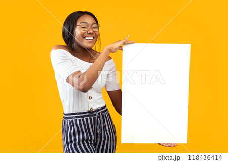 Great Offer. African American Girl Holding Blank Board For Text Standing On Orange Background In Studio. Mockup 118436414