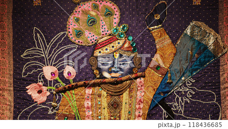 Close-up View On Image Of Krishna Made From Colorful Fabrics And Embroidery With Sparkling Beads. Worship Of God Krishna. Krishna Is Major Deity In Hinduism. He Is God Of Protection, Love, Compassion 118436685
