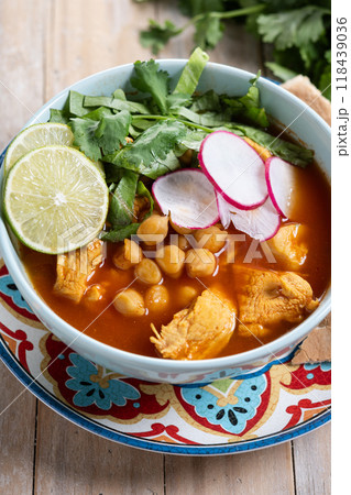 Traditional mexican red pozole soup on wooden table 118439036