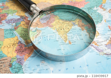 Bangkok, Thailand - June 15, 2024 India, Magnifying glass close up with colorful world map, travel, geography, tourism and exploration concept. Bangkok, Thailand - June 15, 2024 India, Magnifying glass close up with colorful world map, travel, geography, tourism and exploration concept. 118439917