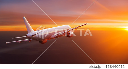 Passengers commercial airplane flying above clouds in sunset light. Concept of fast travel, holidays and business. Passengers commercial airplane flying above clouds in sunset light. Concept of fast travel, holidays and business. 118440011