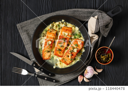 salmon piccata with lemon caper sauce in a pan salmon piccata with lemon caper sauce in a pan 118440478