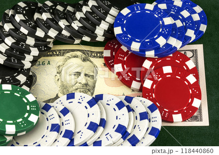 On banknotes are casino chips. On the green baize lies banknotes. On the bill are casino chips. On banknotes are casino chips. On the green baize lies banknotes. On the bill are casino chips. 118440860