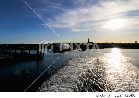 View of the island of Bornholm from the sea in the evening 118442090