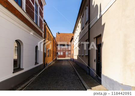Narrow streets of the old town with colorful houses. 118442091