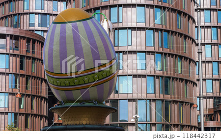 A large decorative Easter egg against a modern building in the city of Copenhagen 118442317