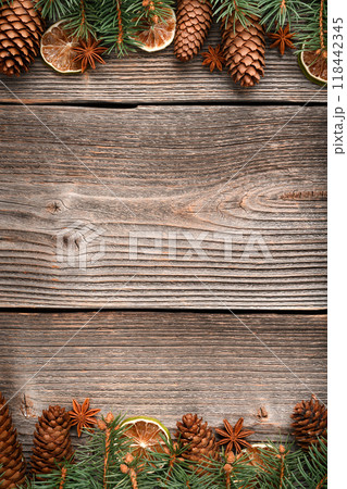 Christmas or New Year background with a border of green fir branches Christmas or New Year background with a border of green fir branches 118442345