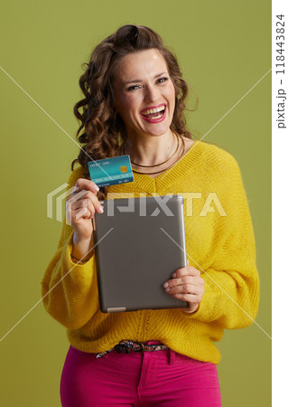 happy healthy 40 years old woman against green background happy healthy 40 years old woman against green background 118443824