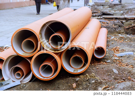 Sewer pipes made of HDPE polyethylene awaiting installation as backbone of new infrastructure project 118444083