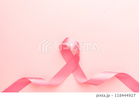 Breast Cancer Awareness Month in October banner. Pink ribbon awareness symbol for supporting breast cancer patient on pink background with copy space. Women's health care and medical. 118444927