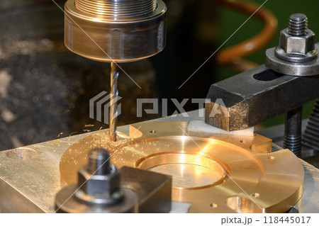The hole drilling process on NC milling machine with brass material. 118445017