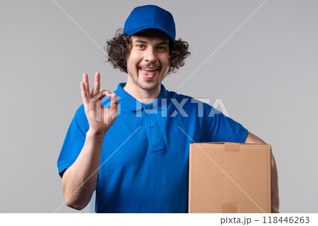 Positive postal courier man with hands sign OK, okay. Happy postman on white. 118446263