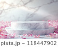 A white marble podium with soft pink rose petals scattered around, ideal for wedding or luxury-themed displays 118447902