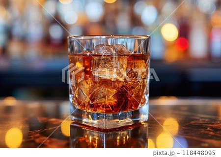 Whiskey on a wooden table with ice  118448095
